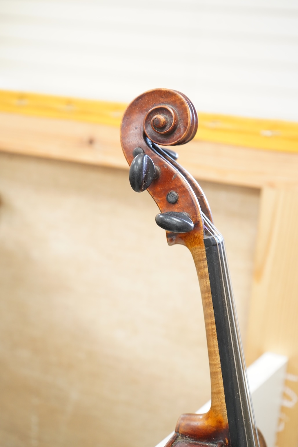 An early 20th century cased violin and cover, 60cm long
